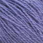 Close-up image of Halcyon Yarn's Victorian 2-Ply Wool Yarn in a soft, textured sport weight with a rich lavender hue. The wool fibers appear loosely spun, giving a slightly fuzzy look, ideal for hand knitting or crocheting projects. The lighting accentuates the different shades of purple within the strands.