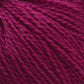 Close-up image of Victorian 2-Ply Wool Yarn by Halcyon Yarn showcasing its deep magenta color and soft, fibrous texture. The strands are tightly wound, and the overall appearance is plush and inviting—perfect for hand knitting projects.