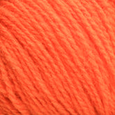 Close-up view of a ball of Victorian 2-Ply Wool Yarn in bright orange, sport weight with a slightly fuzzy texture, showing the individual strands interwoven together—perfect for hand knitting. This exquisite yarn is brought to you by Halcyon Yarn.