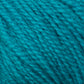 A skein of Halcyon Yarn's Victorian 2-Ply Wool Yarn is coiled neatly against a white background. The yarn appears soft and slightly textured, suitable for knitting or crocheting projects. The color is a rich, medium blue. Perfect for creating intricate multi-color sweater designs.