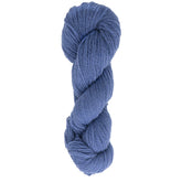 A skein of Halcyon Yarn's Victorian 2-Ply Wool Yarn, in a beautiful blue hue, is elegantly twisted into an elongated shape against a simple white background. This soft yarn features a slightly textured appearance, making it ideal for sport weight projects.