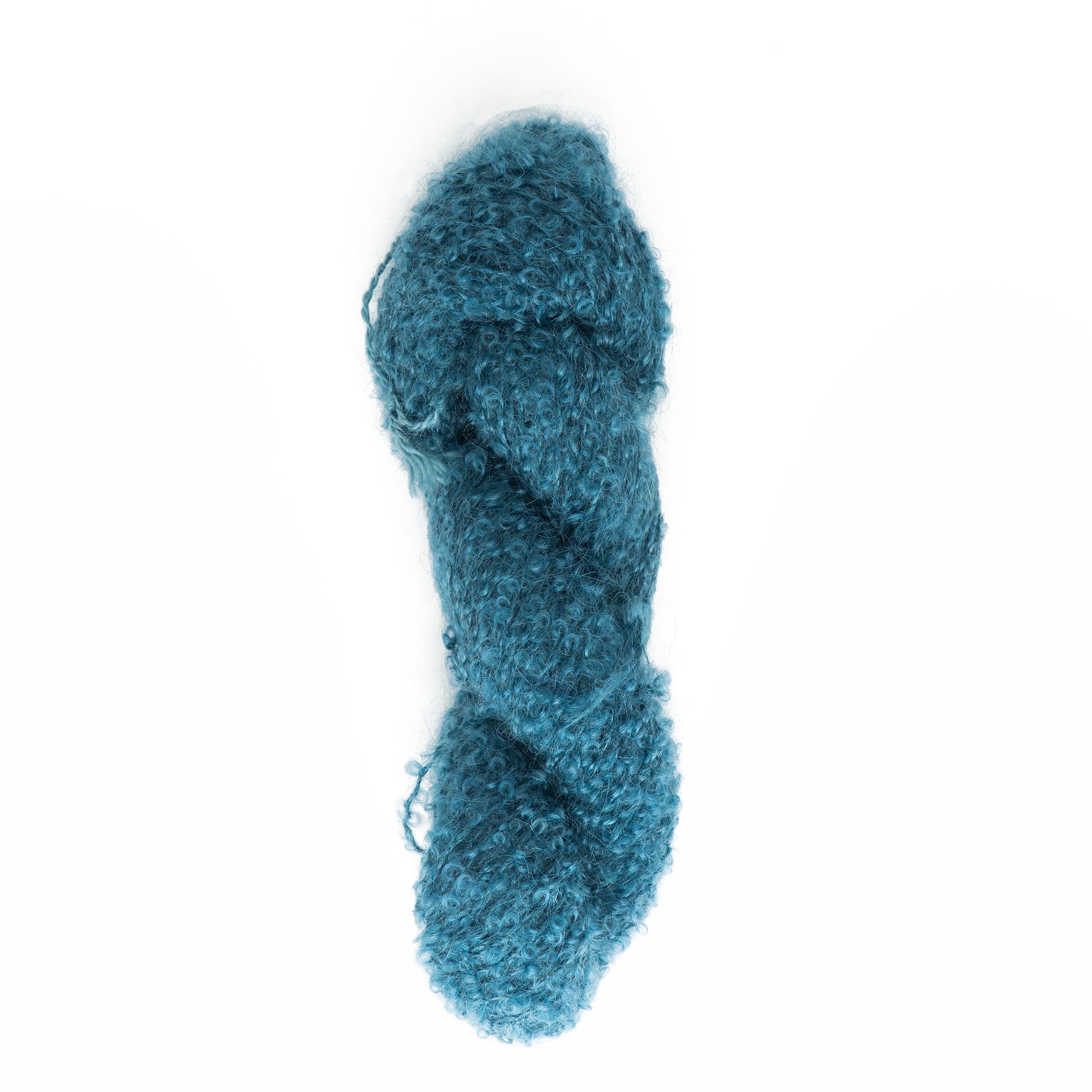 A skein of Victorian Bouclé Mohair Yarn from Caledonian Dye Works is coiled neatly against a plain white background. The textured, blue-green yarn appears soft and fuzzy, perfect for cozy, handmade items like scarves or sweaters.