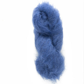 Displayed against a white background is the Victorian Brushed Mohair Yarn in a mini skein by Caledonian Dye Works. This fluffy, airy blue yarn is made from natural fiber and features a soft, wispy texture, lightly twisted into a loose skein.