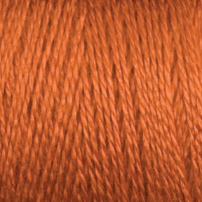 Close-up view of a spool of Maurice Brassard 8/2 Tencel Yarn | Tube in brown, showcasing its smooth, slightly glossy texture. The individual strands are tightly wound together, creating a uniform appearance—perfect for weaving projects or knitting accessories.