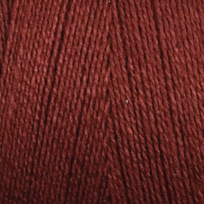 Close-up of a ball of Maurice Brassard's 8/2 Tencel Yarn | Tube in dark red, with tightly wound strands, showcasing its texture and color. The yarn appears smooth and evenly spun, perfect for weaving projects or knitting accessories, indicating it is made from high-quality Tencel yarn.