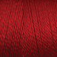 Close-up image of a spool of Maurice Brassard 8/2 Tencel Yarn | Tube in red, showing the tightly wound strands. Ideal for weaving projects, the texture and vibrant color of this Tencel yarn are clearly visible.