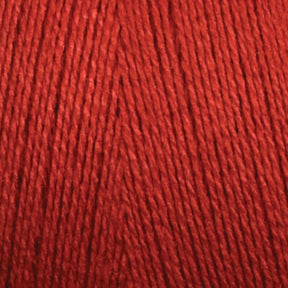 Close-up image of Maurice Brassard 8/2 Tencel Yarn | Tube in red, highlighting the texture and carefully wound fibers. The yarn strands are parallel and tightly packed together, creating a uniform and smooth surface—perfect for knitting accessories or weaving projects.