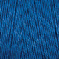 Close-up image of vibrant blue 8/2 Tencel Yarn | Tube by Maurice Brassard, revealing the texture and tightly twisted fibers. The yarn looks smooth with subtle tone variations due to the lighting, giving it a rich and slightly shiny appearance. Perfect for weaving projects or other knitting accessories.