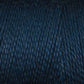 Close-up of Maurice Brassard's 8/2 Tencel Yarn in dark blue, showcasing its tightly wound texture and subtly varied shades. The fibrous surface makes it perfect for weaving projects or a great addition to your knitting accessories collection.