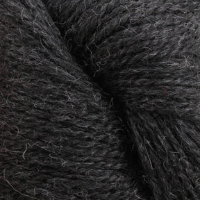 Close-up image of Herriot Fine Alpaca by Juniper Moon Farm in dark gray, showcasing its soft and fibrous texture with slight variations in color and fine strands interwoven tightly together. Ideal for creating sumptuous socks or lightweight accessories. This exquisite yarn is brought to you by Knitting Fever / Euro.