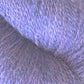 Close-up of Herriot Fine Alpaca yarn by Juniper Moon Farm, a product from Knitting Fever / Euro, showcasing its lilac-colored fibers with a soft, textured appearance. The yarn strands are woven tightly together, creating a smooth, fluffy surface reminiscent of sumptuous socks. The image captures the fine details and subtle variations in the Baby alpaca fibers and colors.