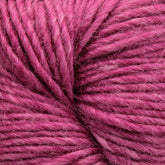 Close-up image of Moonshine by Juniper Moon Farm yarn, showing the detailed texture and intertwined fibers. The yarn, made from a luxurious blend of silk and alpaca, appears to be soft and slightly fuzzy, with a rich, vibrant pink color. This exquisite product is offered by the brand Knitting Fever / Euro.