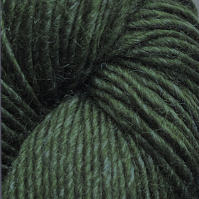 Close-up image of Moonshine by Juniper Moon Farm, a dark green wool yarn. The fibers appear tightly wound and soft, with a slightly fuzzy texture. The strands reflect light subtly, highlighting the yarn’s intricate twists and the depth of its green color. This beautiful yarn is brought to you by Knitting Fever / Euro.