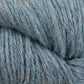 Close-up image of blue-gray Juniper Moon Farm Herriot Baby Alpaca yarn by Knitting Fever / Euro, highlighting its soft and textured threads. The DK weight yarn appears thick and cozy, making it perfect for knitting or crocheting projects. The extrafine baby alpaca fibers have a slightly fuzzy appearance, adding to the overall warmth and softness of the material.