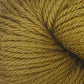 Close-up of a skein of Juniper Moon Farm Herriot Baby Alpaca yarn in a golden yellow color. The texture of the DK weight yarn is visible, showcasing tightly spun fibers and a soft, wool-like appearance reminiscent of extrafine baby alpaca from Knitting Fever / Euro.