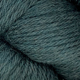 Close-up image of a greenish-blue, densely woven DK weight yarn from the Juniper Moon Farm Herriot Baby Alpaca collection by Knitting Fever / Euro. The extrafine baby alpaca fibers are soft with slight fuzziness, featuring intricate twists and small loose fibers protruding. The color is uniform with subtle variations, enhancing the texture's depth.