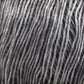 Close-up of densely packed Katia Air Lux yarn. The strands, aligned vertically, showcase varying shades of grey from light to dark, creating a textured and patterned effect. The fibers appear soft and slightly shiny.