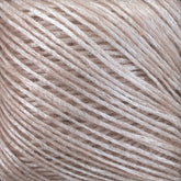 Close-up image of a ball of light beige Katia Air Lux fingering weight yarn by Knitting Fever / Euro, featuring its slightly shiny texture and intricate overlapping strands with fibrous details. The image highlights the smoothness and soft appearance of the Merino wool yarn.