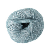 A skein of Katia Air Lux, a light blue Merino wool yarn from Knitting Fever / Euro, is showcased against a plain white background. This delicate fingering weight yarn features a smooth and shiny texture, making it perfect for intricate projects.