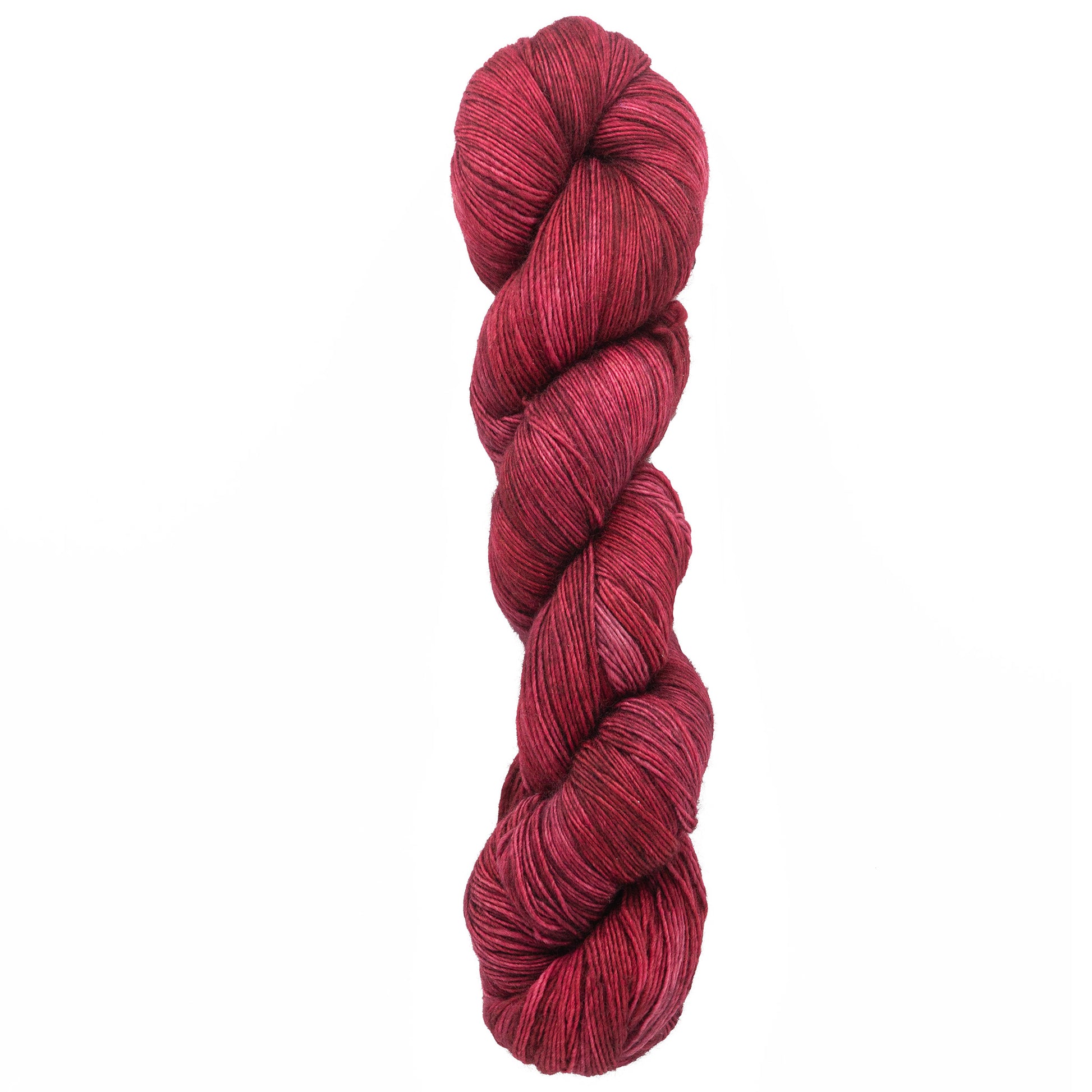 A tightly wound skein of deep red Malabrigo Lace by Malabrigo Yarn, intricately twisted and rich in color, evokes visions of cozy knitted shawls. It rests elegantly against a plain white background.