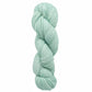 A skein of Malabrigo Lace yarn by Malabrigo Yarn, in a light mint green hue, is neatly coiled against a plain white background. The yarn appears soft and finely spun, ideal for crafting delicate lace weight merino projects such as knitted shawls.