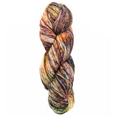 A skein of Malabrigo Sock by Malabrigo Yarn, made from superwash merino wool and featuring a mix of red, yellow, green, and black speckles, is twisted neatly into a hank against a plain white background.