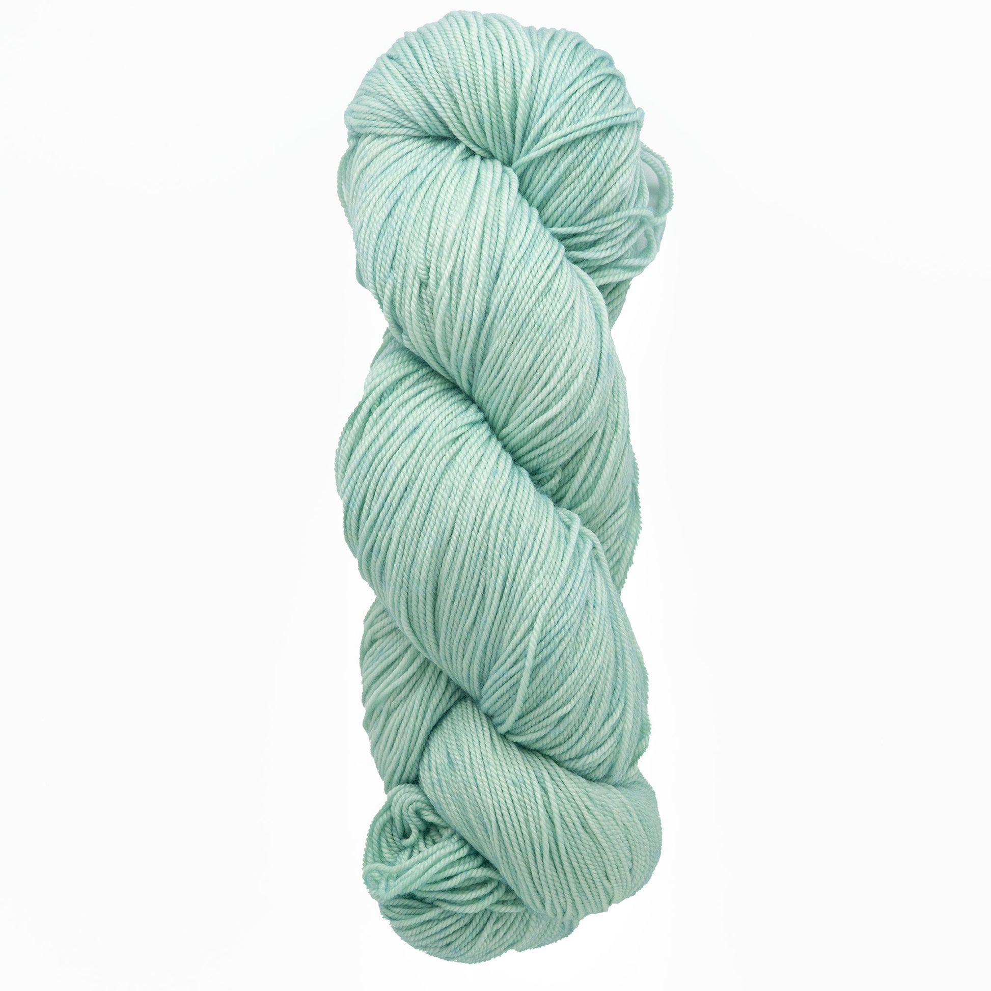 A skein of Malabrigo Sock yarn by Malabrigo Yarn, in a light mint green shade, crafted from superwash merino wool, neatly twisted against a white background.