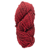 A skein of Malabrigo Caracol by Malabrigo Yarn in deep red, featuring a kettle-dyed merino wool with a soft, textured appearance, coiled into a compact, cylindrical shape against a white background.