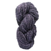 A twisted skein of deep purple, glossy Malabrigo Caracol by Malabrigo Yarn, intricately woven into a tight coil, set against a plain white background.