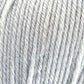 Close-up view of a soft, light grey yarn made from 100% Cascade Yarns' Cascade 220 Superwash Wool Yarn. The image shows the DK weight yarn's texture in detail, with clearly visible fibers and twists. The overall appearance is fluffy and slightly fuzzy, highlighting the fine threads and beautiful stitch definition.