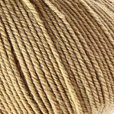 Close-up of a ball of tan-colored Cascade 220 Superwash Wool Yarn by Cascade Yarns, showcasing the texture and twist of its fibers. The superwash DK weight yarn appears soft and thick, tightly wound into a neat ball, ensuring beautiful stitch definition.