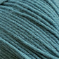 Close-up of a ball of Cascade 220 Superwash Wool Yarn from Cascade Yarns. The light blue, DK weight fibers are tightly wound and exhibit a slight fuzzy texture. Made from 100% merino wool, the image highlights the beautiful stitch definition and soft texture of the yarn.