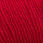 Close-up of bright red Cascade 220 Superwash Wool Yarn from Cascade Yarns, showcasing its smooth and tightly twisted strands. The texture appears soft and slightly fuzzy, with the 100% merino wool fibers tightly wound together in a uniform pattern. The vibrant color is consistent throughout, offering beautiful stitch definition.