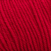 Close-up of bright red Cascade 220 Superwash Wool Yarn from Cascade Yarns, showcasing its smooth and tightly twisted strands. The texture appears soft and slightly fuzzy, with the 100% merino wool fibers tightly wound together in a uniform pattern. The vibrant color is consistent throughout, offering beautiful stitch definition.