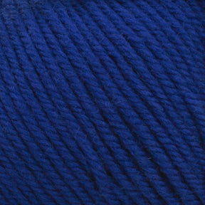 Close-up image of Cascade 220 Superwash Wool Yarn by Cascade Yarns in deep blue, wound into a ball. The 100% merino wool strands are tightly woven together, creating a textured, fibrous surface that boasts beautiful stitch definition.