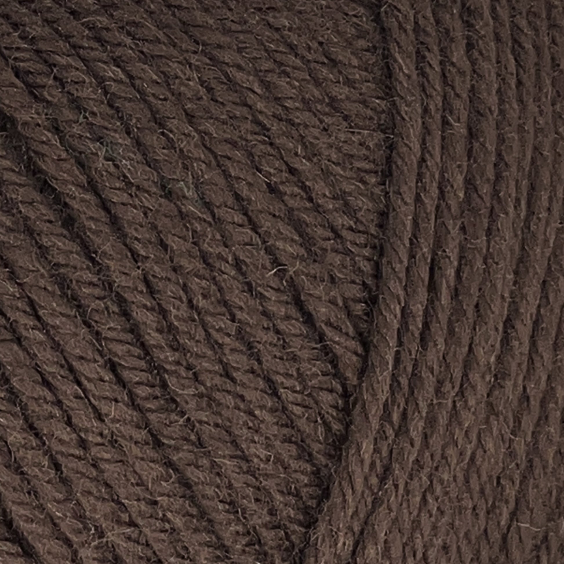 Close-up image of dark brown Cascade 220 Superwash Wool Yarn by Cascade Yarns, showcasing the texture and beautiful stitch definition of the twisted fibers made from 100% merino wool.