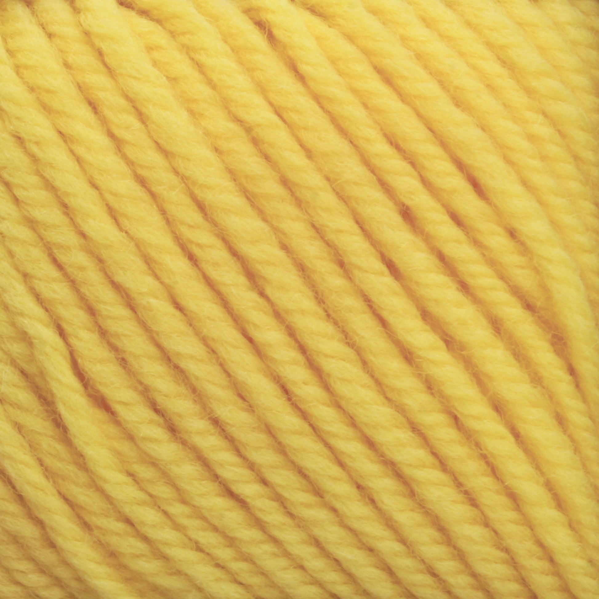 Close-up image of bright yellow Cascade 220 Superwash Wool Yarn. The DK weight yarn from Cascade Yarns is tightly twisted, and the texture is clearly visible, with the strands appearing soft and slightly fuzzy. Made from 100% merino wool, the vibrant color is consistent throughout the frame, highlighting its beautiful stitch definition.