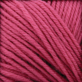 Close-up image of Cascade 220 Superwash Wool Yarn by Cascade Yarns, crafted from 100% merino wool. The bright pink strands are neatly twisted and intertwined, showcasing the vibrant color and beautiful stitch definition of this superwash DK weight yarn.