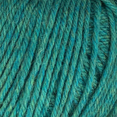 Close-up view of Cascade 220 Superwash Wool Yarn by Cascade Yarns in teal, showcasing tightly wound fibers and a soft, textured appearance. Made from 100% merino wool, the yarn boasts beautiful stitch definition and a mix of blue and green hues, giving it a vibrant yet soothing color palette.