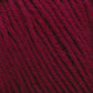 Close-up of Cascade 220 Superwash Wool Yarn in burgundy, showcasing its twist and texture. The rich, deep red 100% merino wool fibers are tightly wound, highlighting the intricate details and beautiful stitch definition. The yarn appears soft and thick, suitable for knitting or crocheting.