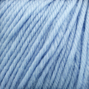 Close-up image of Cascade 220 Superwash Wool Yarn by Cascade Yarns in a light blue, showing tightly twisted fibers and a soft, fluffy texture. The threads are evenly spaced and neatly wound, creating a smooth, consistent pattern. The yarn's soft appearance suggests it is suitable for knitting or crocheting.