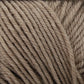 Close-up of light brown yarn strands tightly wound together. The texture shows the individual fibers making up this 100% merino wool Cascade 220 Superwash Wool Yarn by Cascade Yarns, emphasizing its softness and beautiful stitch definition.