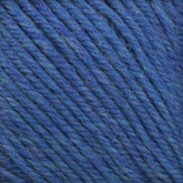 A close-up view of Cascade Yarns' Cascade 220 Superwash Wool Yarn, showcasing its tightly twisted strands and soft, woolen texture. Made from 100% merino wool, the yarn has subtle variations in shades of blue, giving it a rich, multi-dimensional appearance and beautiful stitch definition.