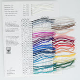 The JaggerSpun Sample Card from Jagger Brothers, Inc. showcases a wide range of yarn colors against a white background. Each yarn sample is meticulously labeled with item numbers and color codes, featuring shades that span from neutrals and pastels to vibrant hues. This array of knitting and crochet options makes the sample card an invaluable design resource.