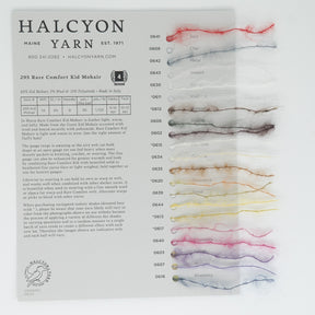 An image of the Halcyon Yarn Jo Sharp Rare Comfort Kid Mohair Yarn Sample Card. The card showcases twenty yarn samples, each labeled with a unique color name such as "Soul," "Char," "Metal," "Swash," "Cider," and "Blueberry.