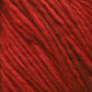 Close-up of Malabrigo Merino Worsted Wool Yarn fibers from Malabrigo Yarn, tightly wound together. The texture is soft and slightly fuzzy, with individual strands visible. The rich and vibrant red color of this worsted weight gauge yarn gives the impression of warmth and coziness.