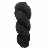 A skein of Malabrigo Merino Worsted Wool Yarn by Malabrigo Yarn, tightly twisted and soft in black, sits against a white background, highlighting its luxurious texture.