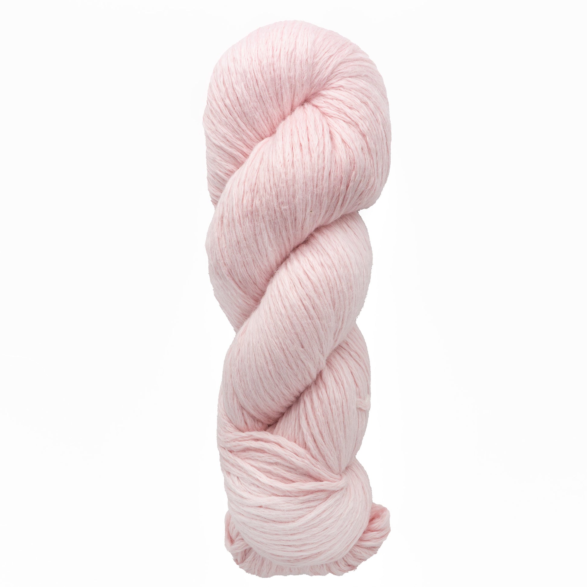 A skein of Cumulus Cotton yarn by Juniper Moon Farm features a soft pink hue, coiled in a twist against a white background. This plush, thick yarn from Knitting Fever / Euro Yarns is ideal for crafting cozy, durable knitting or crocheting projects.