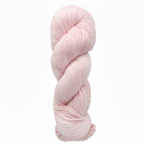 A skein of Cumulus Cotton yarn by Juniper Moon Farm features a soft pink hue, coiled in a twist against a white background. This plush, thick yarn from Knitting Fever / Euro Yarns is ideal for crafting cozy, durable knitting or crocheting projects.