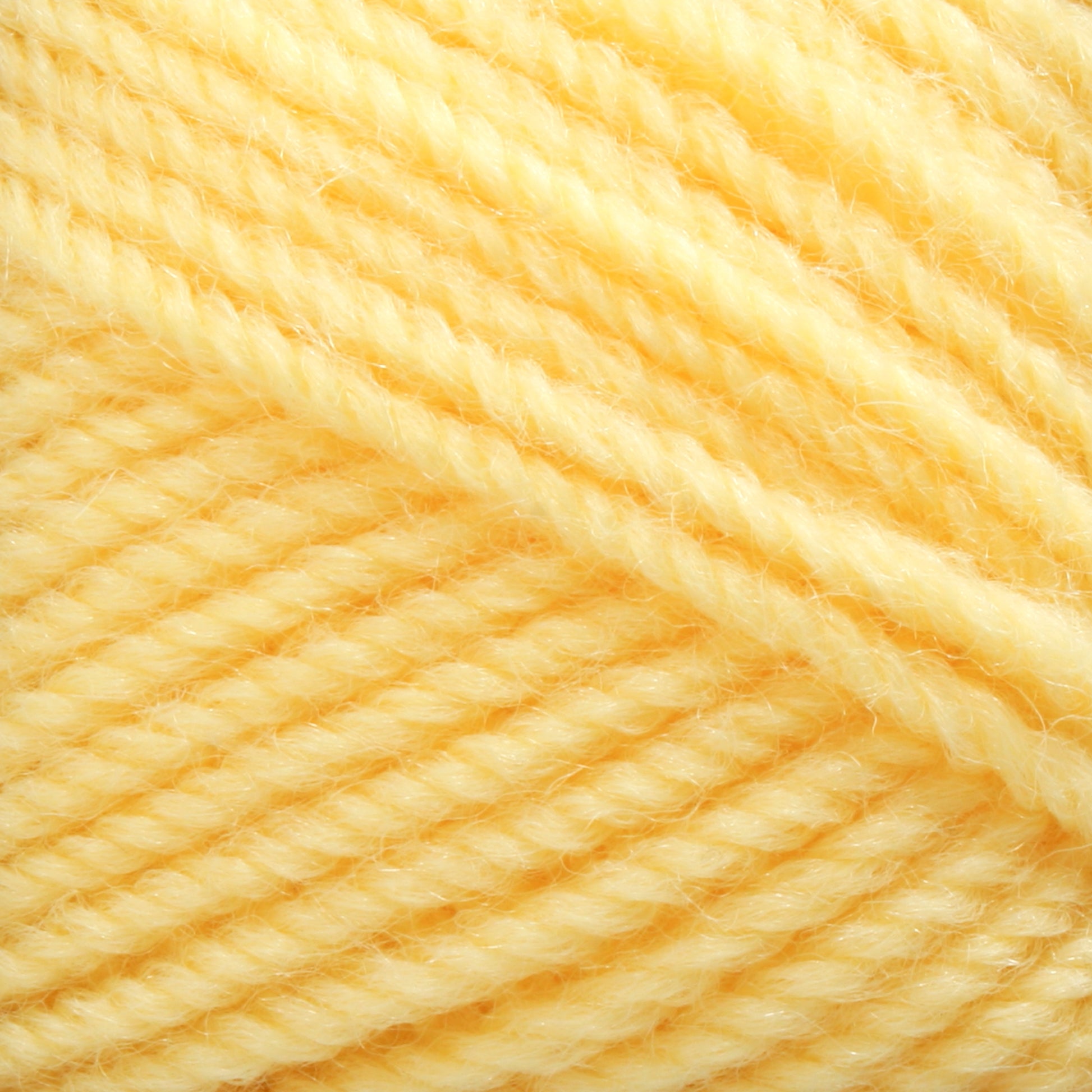 Close-up of a ball of Plymouth Encore Worsted Yarn by Plymouth Yarn Co., showcasing the soft, twisted strands in detail. The bright and consistent yellow color emphasizes the texture and quality of this economical option.